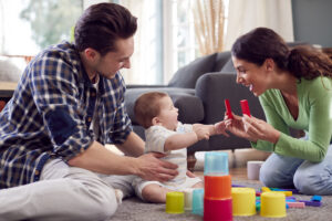 A family play with a young daughter with disabilities.